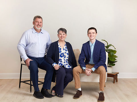 Image of Mike Stott, Donna Stott, and Matt Stott seated